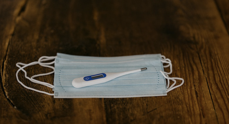 A face mask and thermometer to help employers deal with employees diagnosed with cornavirus