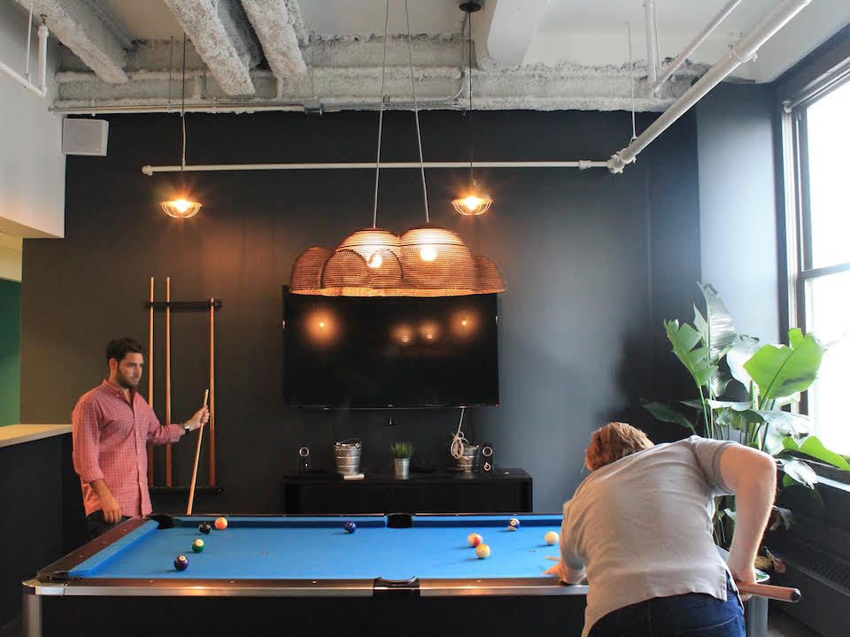 Employees take a well-earned pool break in the Magnetic offices.